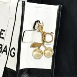 Golden Cherry Keychain Charm - Shiny Resin & Metal Bag Accessory, Elegant Gift tion - Image 5