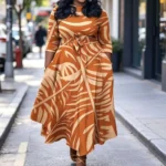 Plus size women's orange palm leaf print plus size midi dress round neck three-quarter sleeves