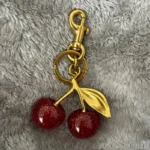 Golden Cherry Keychain Charm - Shiny Resin & Metal Bag Accessory, Elegant Gift tion - Image 3