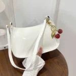 Women's PU Leather Handbag Versatile Fashion Solid Color Cherry Pendant Shoulder - Image 4